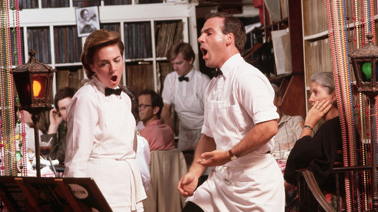 Opera singing waitstaff at Italian restaurant, Victor Cafe, Philadelphia, with patrons surrounding them in historic dining room
