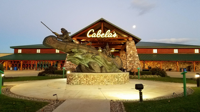 The front of America's largest Cabela's store lit up at night