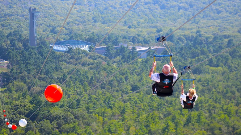 Guests ride the HighFlyer Zipline at Foxwoods