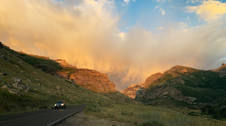 A car driving the scenic route through Lamoille Canyon in the Humboldt Toiyabe National Forest's Ruby Mountains Wilderness