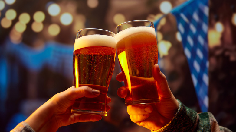 Beer glasses toasting at a classic Oktoberfest