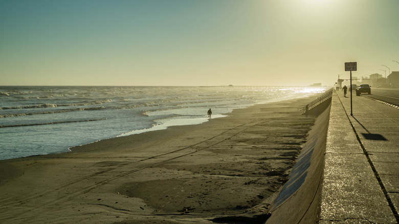 Walkway and sandy beach along Galveston Seawall