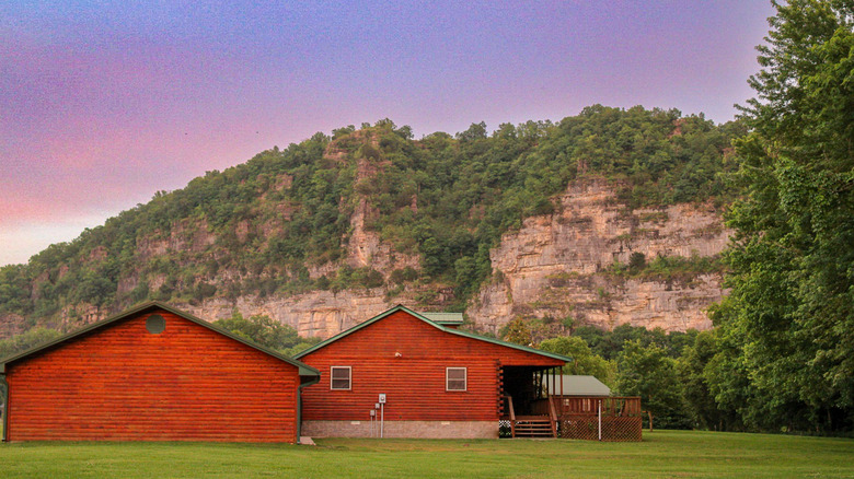 red house with mountains in the background