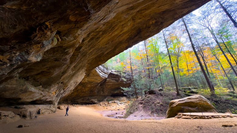A man stands in a cave at Hocking Hills State Park