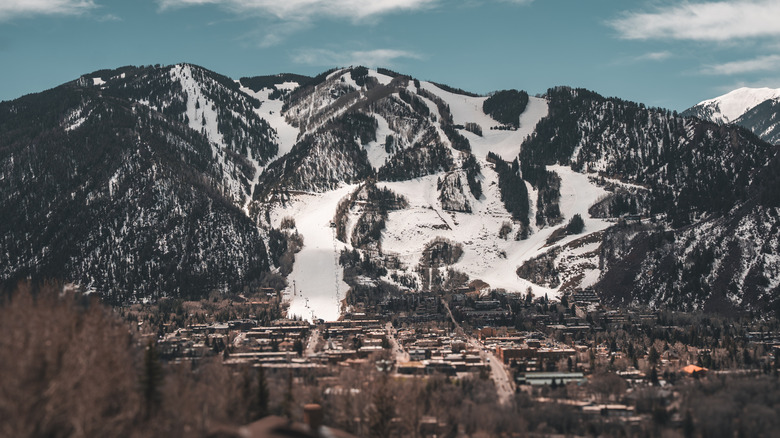 Aspen Mountain rises behind the historic and luxurious town of Aspen, CO