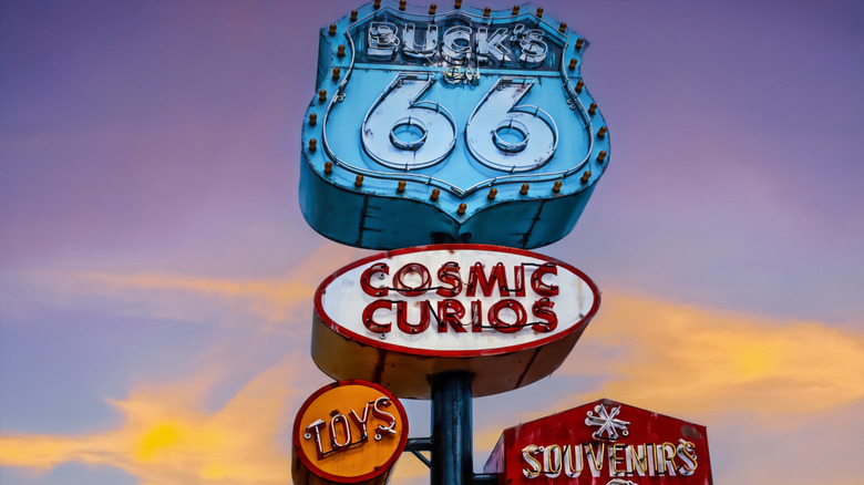 Retro Neon signs on Route 66 through Tulsa for souvenir and cosmic curios shop