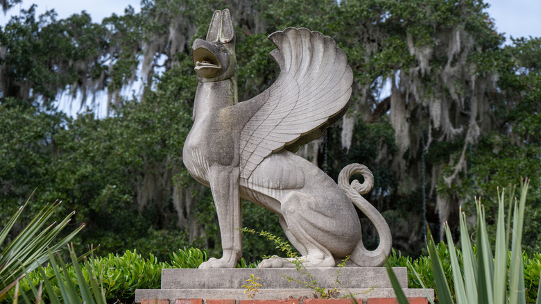 Carved stone griffin statue with wings in the sculpture garden at Brookgreen Gardens, Murrells Inlet, South Carolina