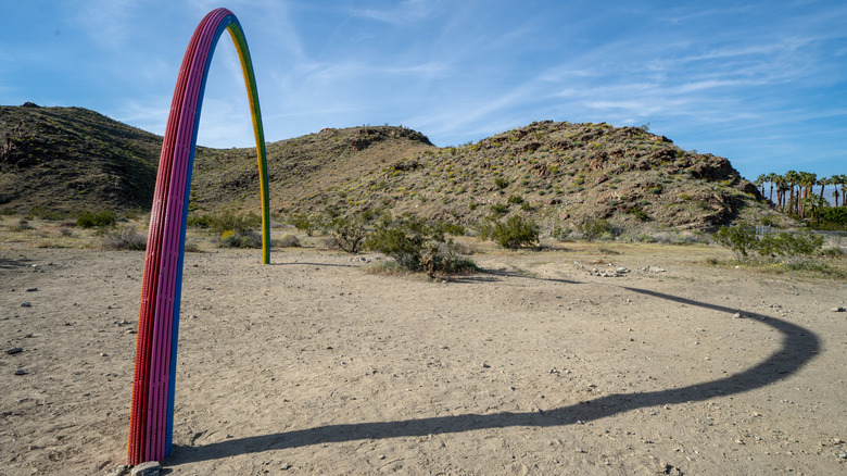 A rainbow sculpture made of rebar in the Coachella Valley, California, during Desert X in 2019
