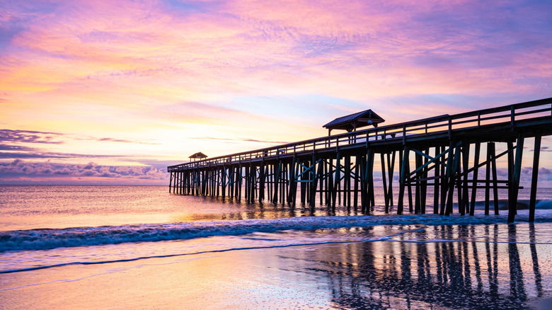 A colorful sunset near a pier on Amelia Island