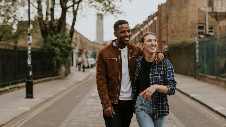 Young couple walking through a picturesque city