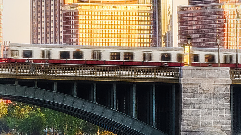 A train crosses a bridge over the Charles River in Boston, Massachusetts