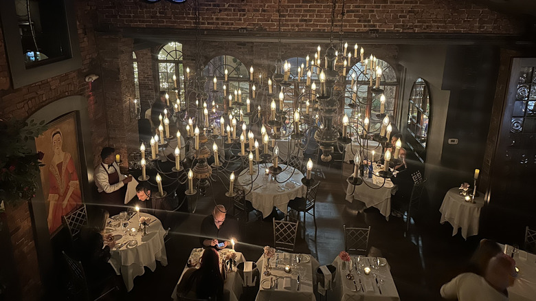 White-clothed tables inside One If By Land, Two If By Sea in New York