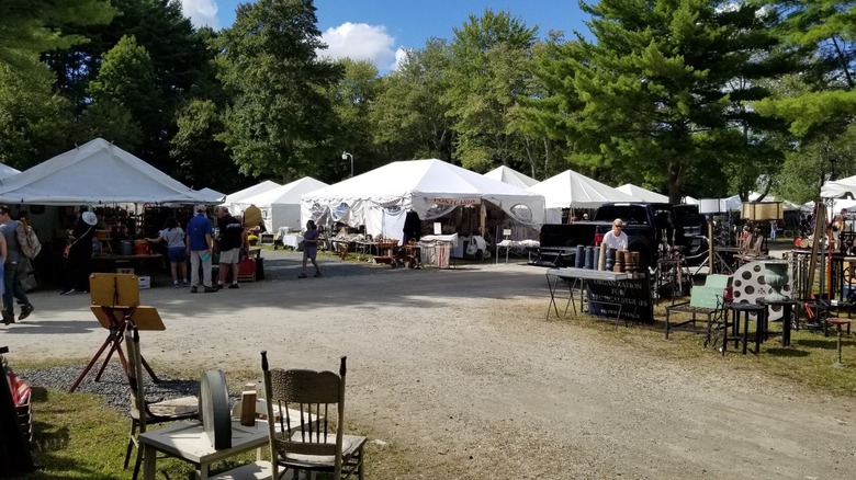 White vendor tents and tables outside at Brimfield Antique Flea Market, Massachusetts