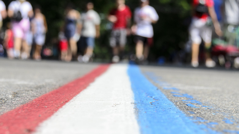 Red white and blue paint marks the Fourth of July parade route on Hope Street in Bristol, Rhode Island