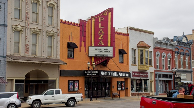 Red marquees outside Plaza Cinema, surrounding buildings