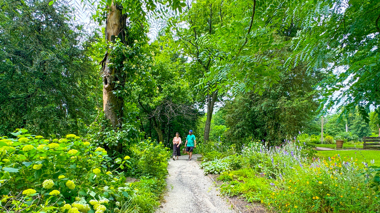 People walking on gravel path at Bartram's Garden, Philadelphia