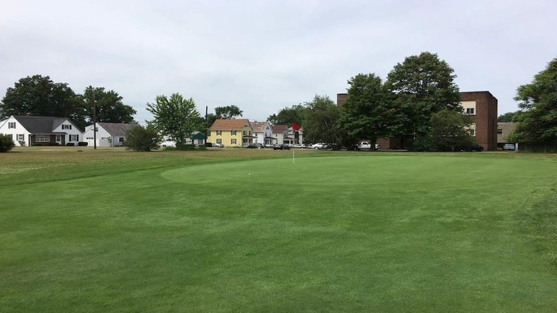 Houses behind a green golf course at Buhl Park Golf Course