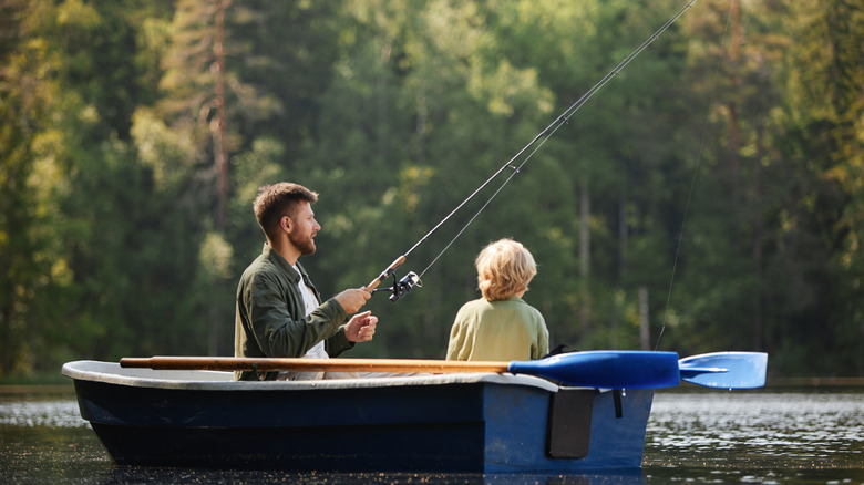 Father and son fishing on a lake