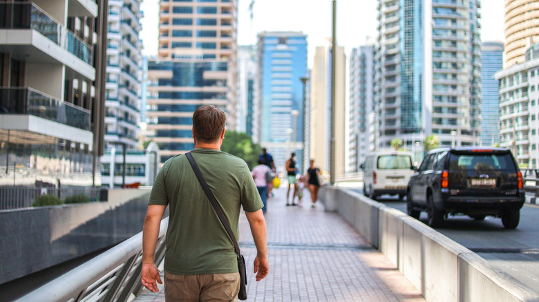 A man walking through a big city
