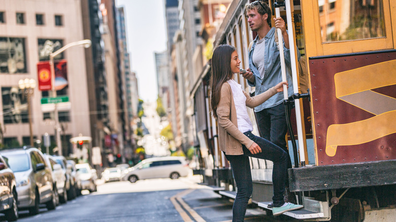 Woman getting on a trolley in San Francisco