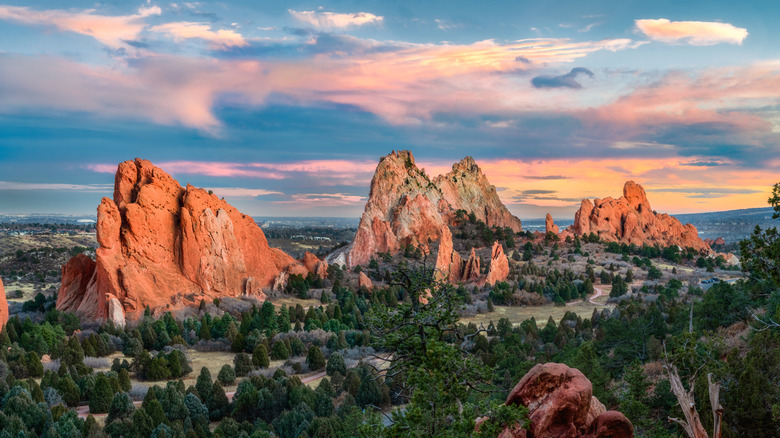 A sunset over sandstone formations at Garden of the Gods park in Colorado.