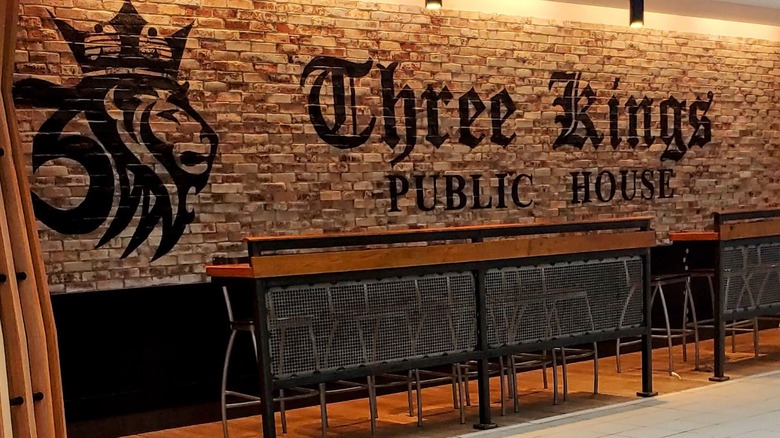 Seating at Three Kings Public House overlooking the airport concourse