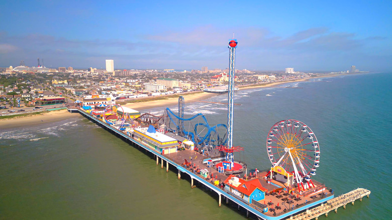 Aerial view of pier and coastline in Galveston