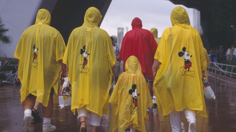 A family walks in the rain at Disney World
