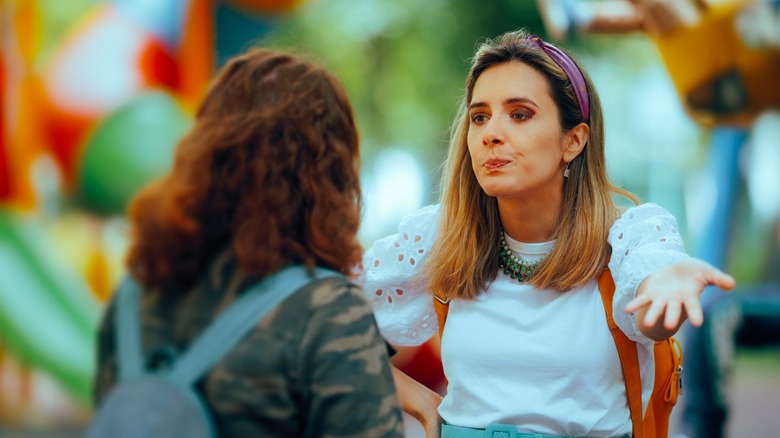 Women shouting at each other in the park