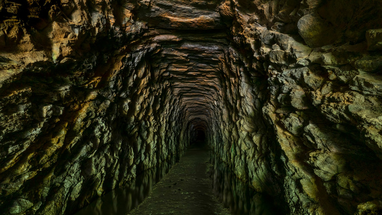 Dark tunnel with rocky walls