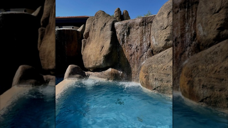 Thermal pool and rock waterfall at Termas de Chaves spa in Chaves, Portugal