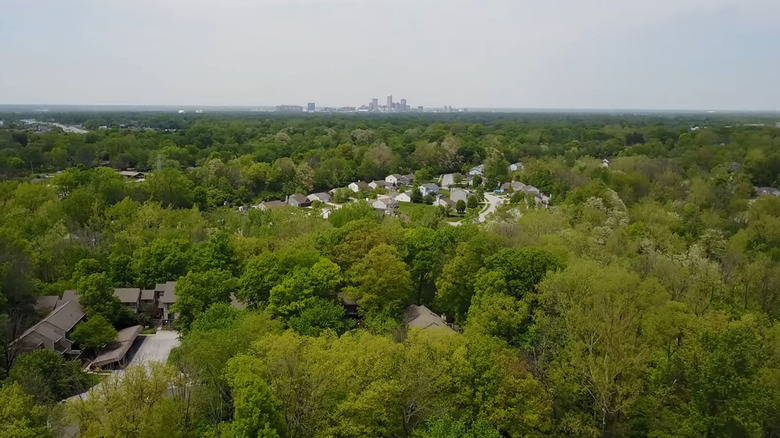 Beech Grove, Indiana, surrounded by trees with Indianapolis in distance