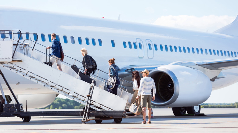 Passengers boarding a plane
