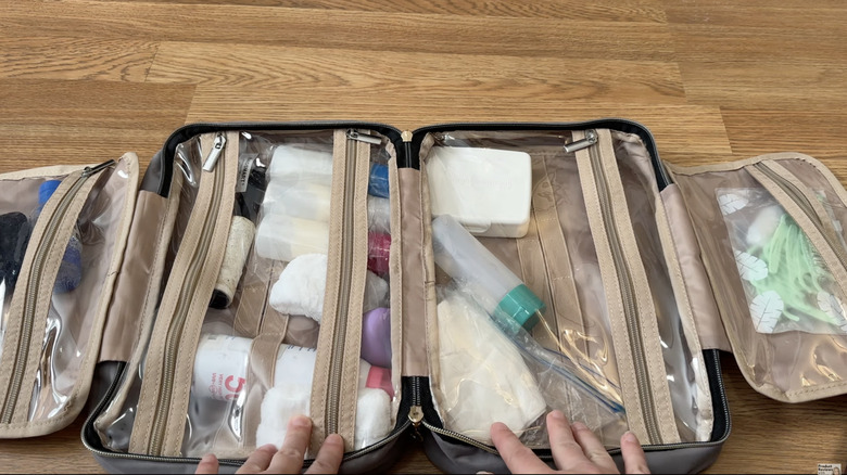 Bagsmart Hanging Toiletry Bag laid out on a table with products inside