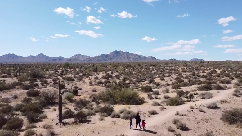 Family walking along trail through McDowell Mountain park