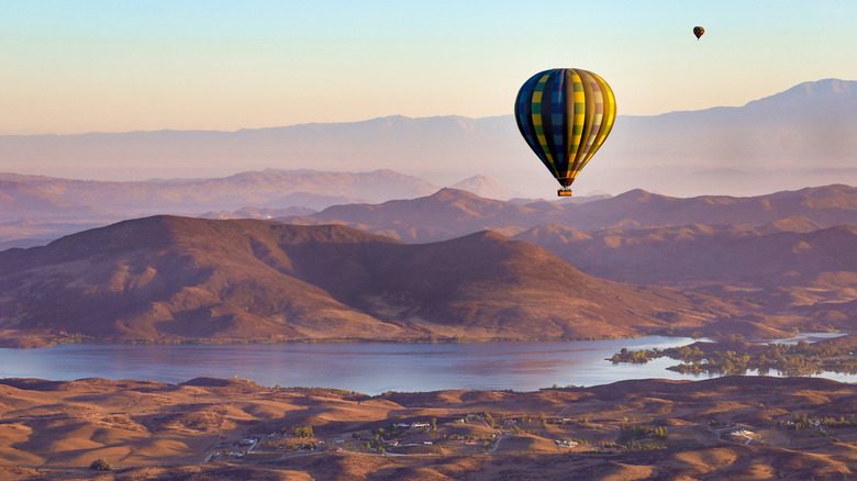 Hot-air balloons fly over Temecula Valley, a wine-producing region in Southern California, around sunrise