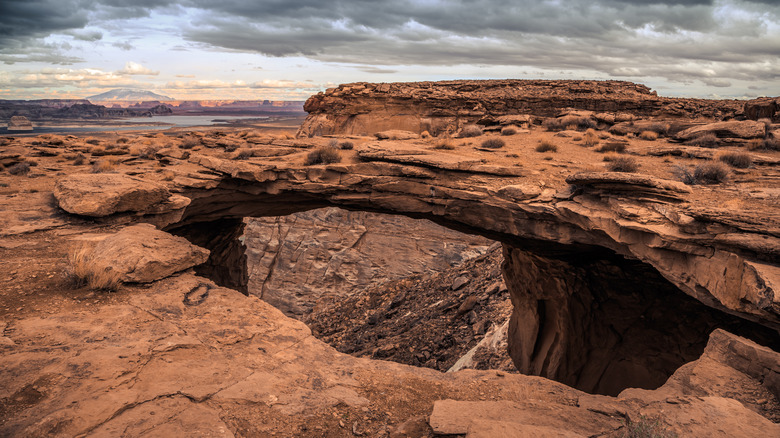 Sunset at Skylight Arch with the view of Lake Powell and Grand Staircase Escalante National Monument in Utah.