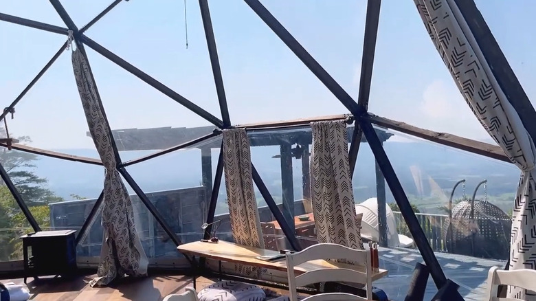 Interior of a geodesic dome lodging looking out to the mountains in Tennessee