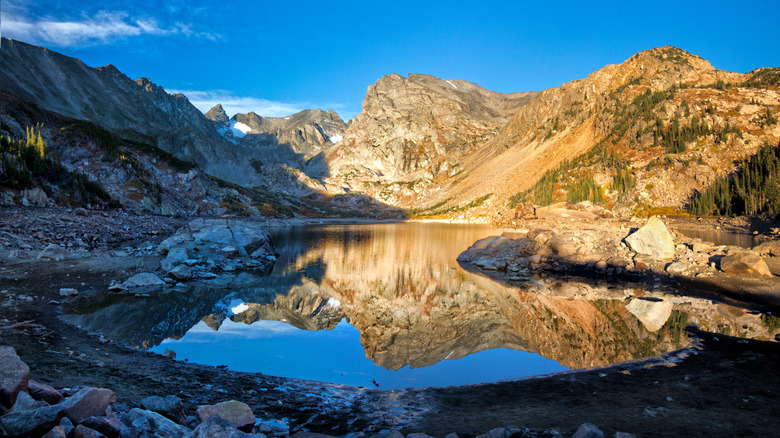 Sunrise at Lake Isabelle with blue skies above