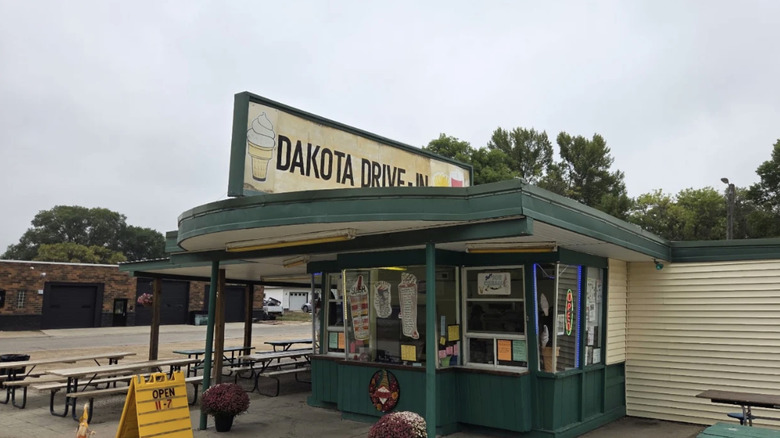 Picnic benches outside Dakota Drive-In on a cloudy day