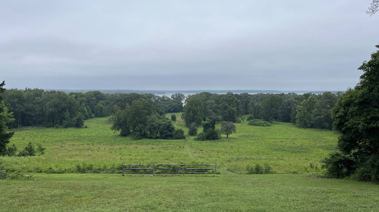 Scenic views over rolling green fields leading out to the Potomac River at Chapman State Park in Maryland