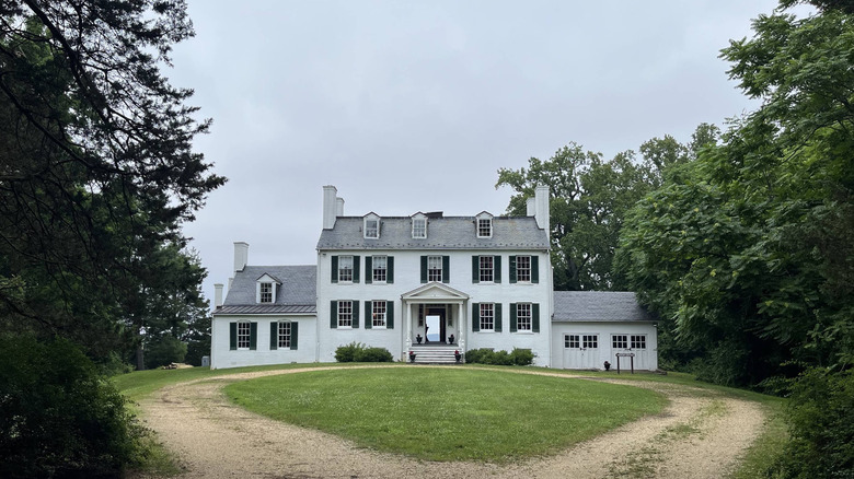 Mount Aventine Manor House flanked by trees at Chapman State Park in Maryland