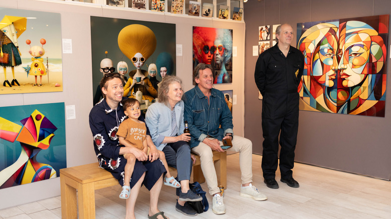 Visitors at the opening of Dead End Gallery in Amsterdam, viewing some of the works created by AI artists