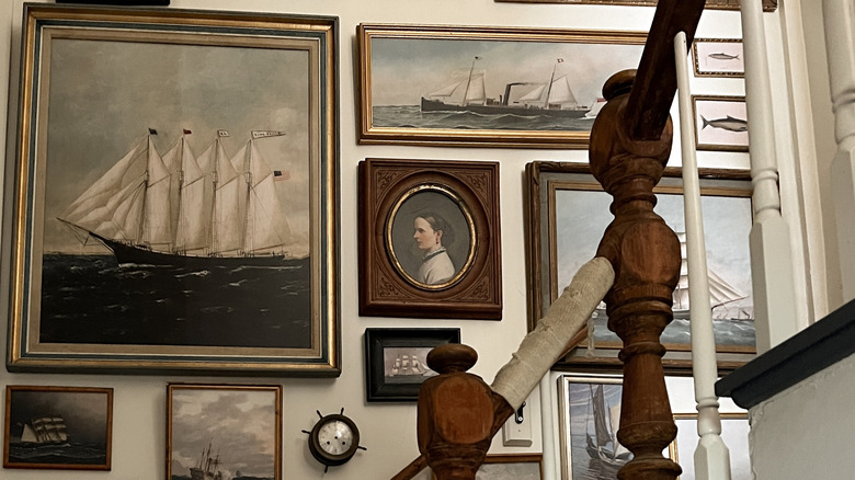 Paintings and portraits hanging in the staircase of the lighthouse keeper's residence on Bakers Island in Salem Sound, Massachusetts.