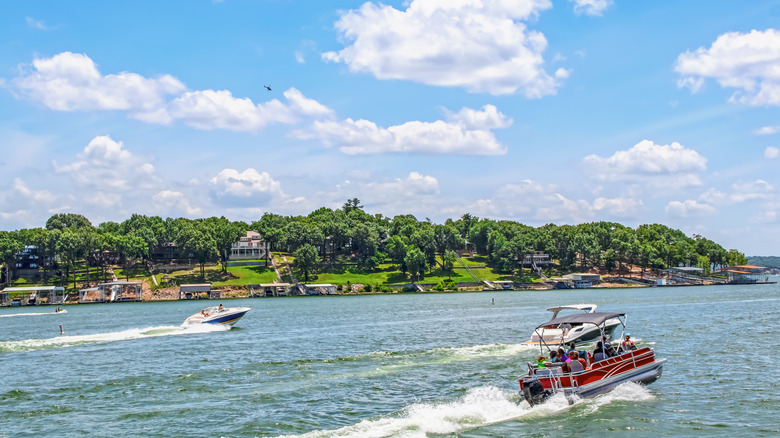 Pontoon and other boats sailing on the water