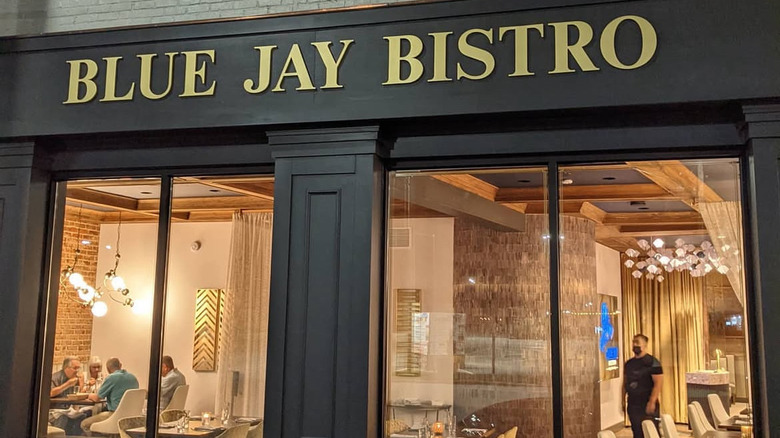 Exterior of Blue Jay Bistro sign and front windows in Littleton, NC