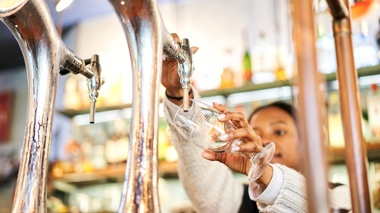 Pouring beer on tap