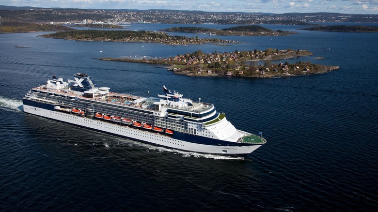 Celebrity Constellation cruise ship sailing past islands