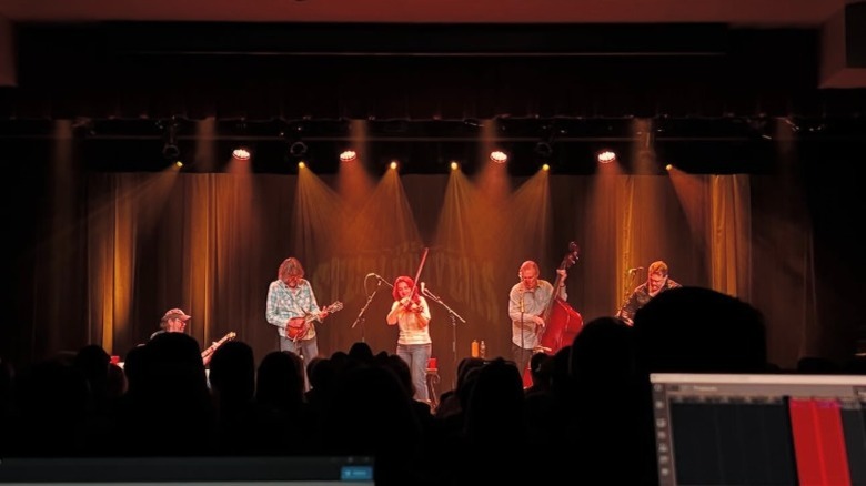 Band on stage at Harvester Performance Center