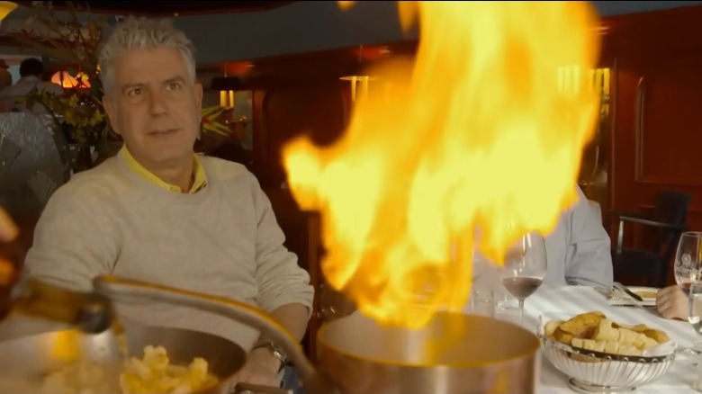 Anthony Bourdain eating at a restaurant in Quebec, Canada